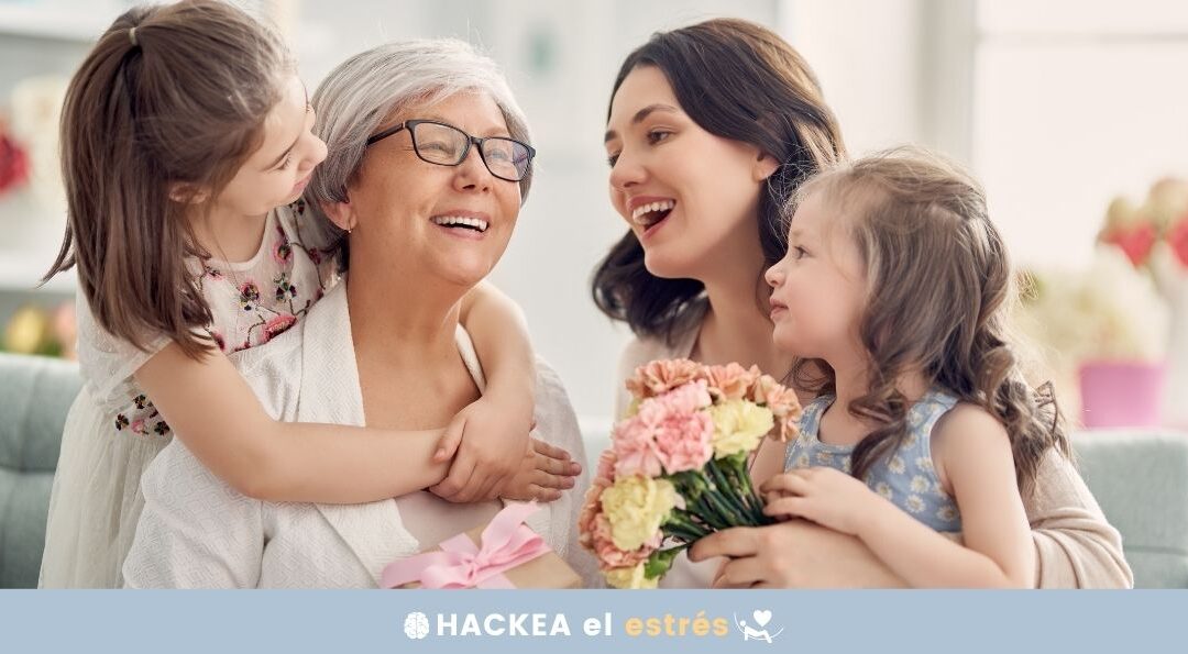 imagen de abuela, madre y dos niñas intercambiando abrazos y flores